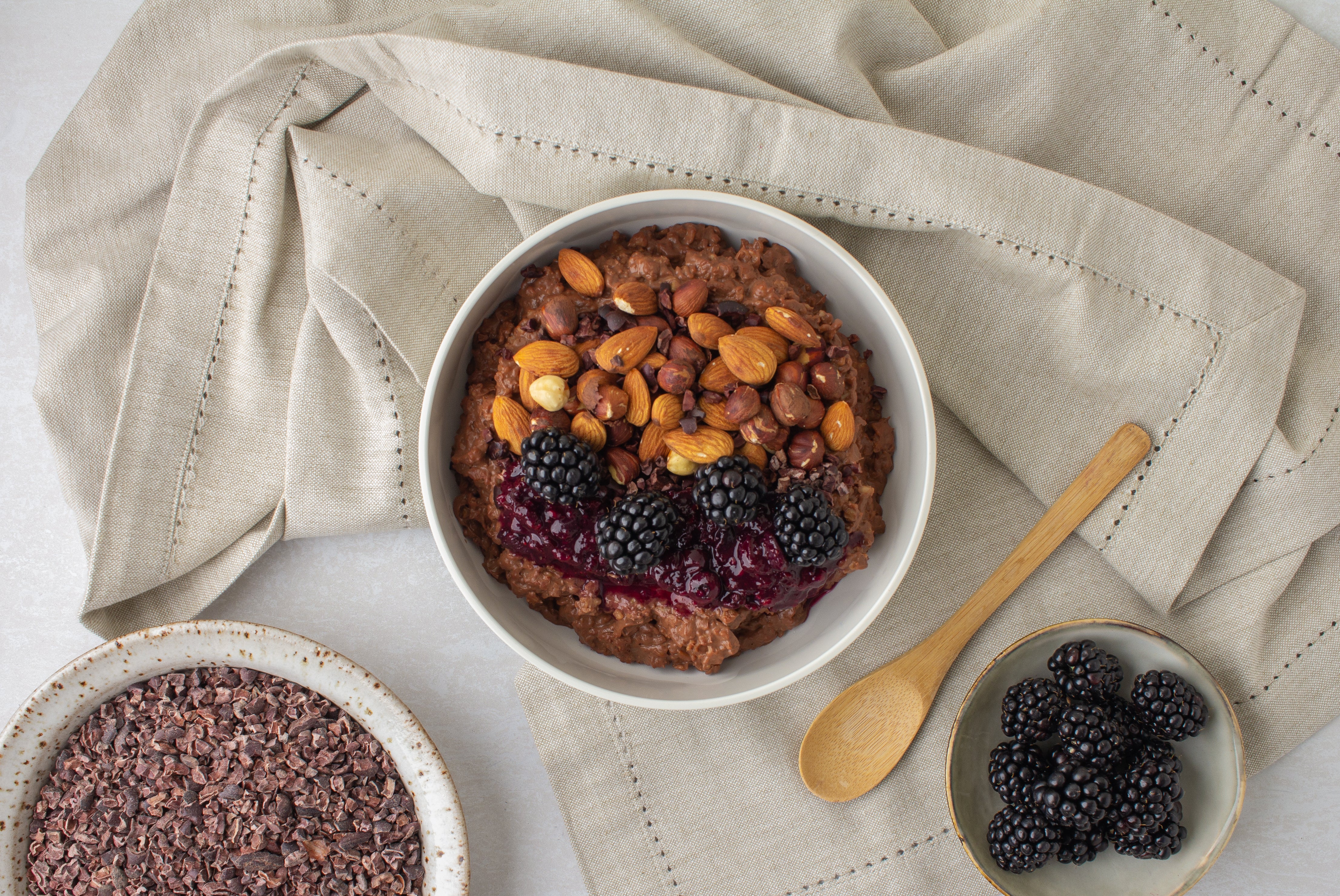 Cacao Porridge With Winter Berry Compote and No-Bake Hazelnut Granola