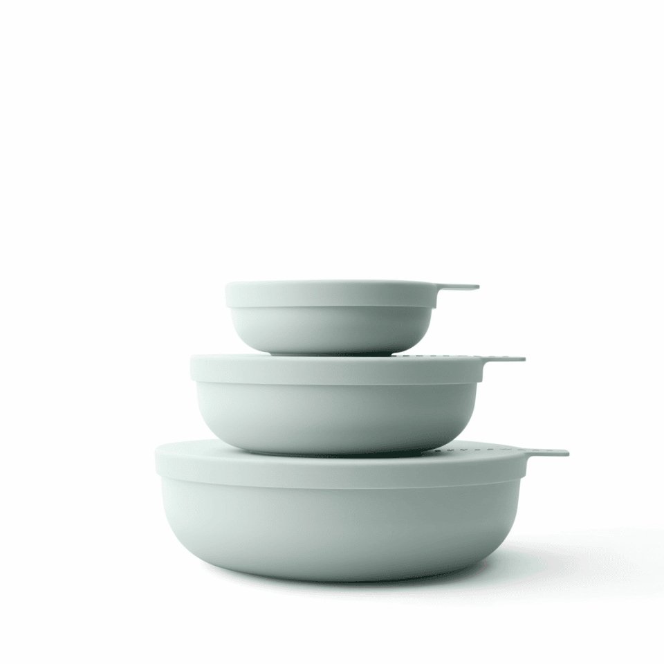 Stacking bowls in a muted eucalyptus green.